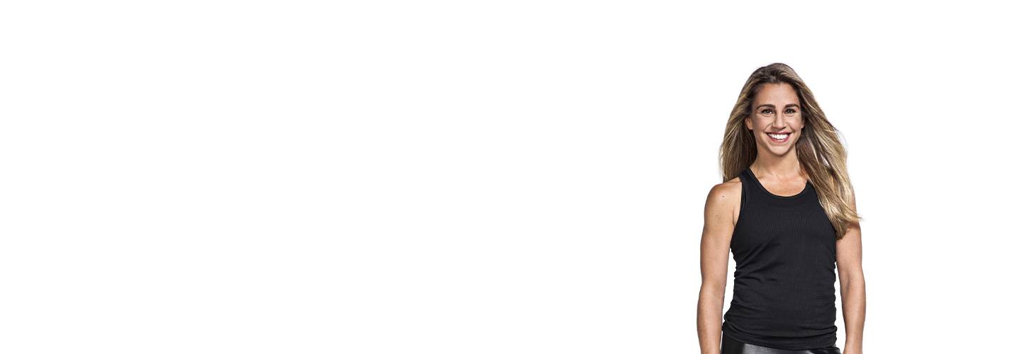 Instructor Alycia Stevenin in black tank top smiling on white background