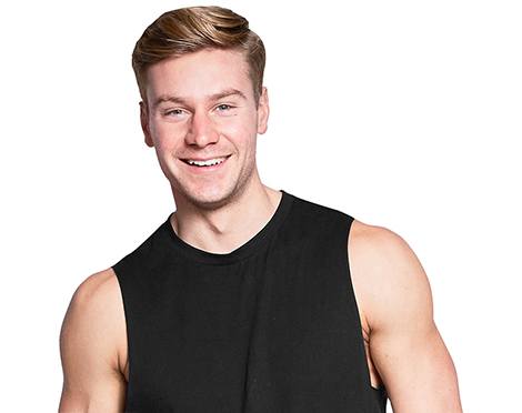 Headshot of Barry's Bootcamp instructor Ben O’Brien wearing a black tank top against a white background.