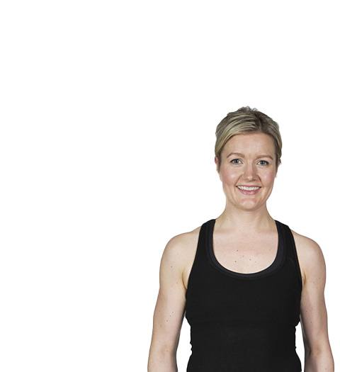 Barry's Bootcamp instructor Cecilie Sletteng in black tank top smiling on white background