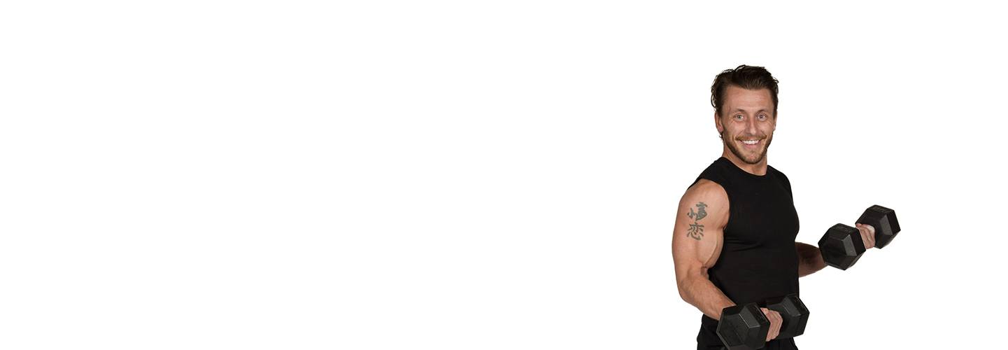 barry's instructor Christian Lawley wearing black tank posing with dumbbells