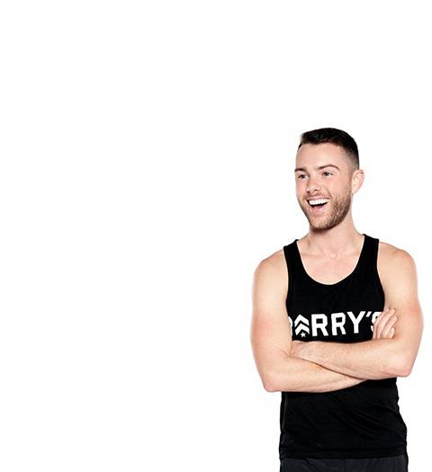 Barry's instructor David Petruzzi in black tank with arms folded