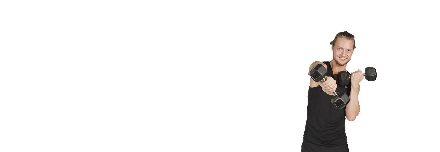 barry's instructor Erik Nordnes wearing black tank posing with dumbbells