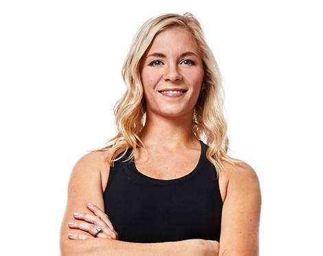 Headshot of instructor Jenna (Mazanowksi) Miller in black tank top smiling with arms folded over chest