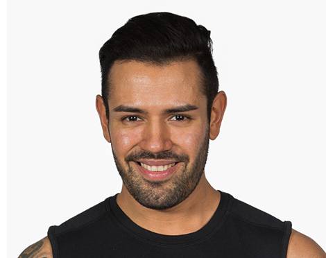 Headshot of instructor Joakim Bergmann in black tank top smiling on white background