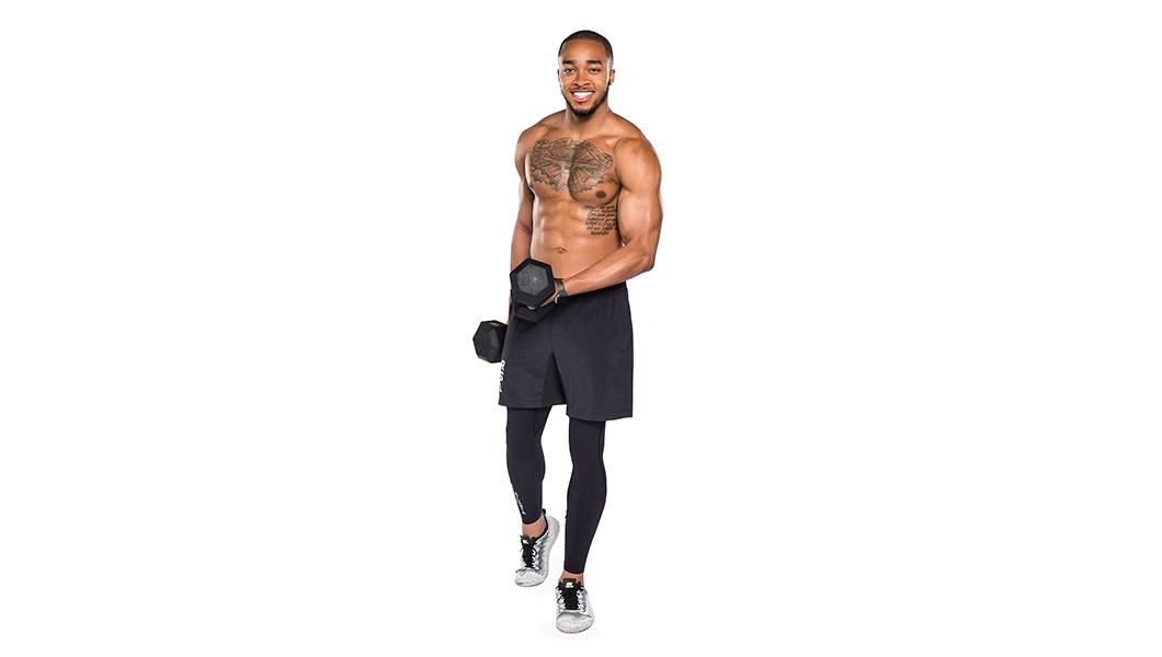 Shirtless Barry's Bootcamp instructor Justyn Solomon holding dumbbells on white background