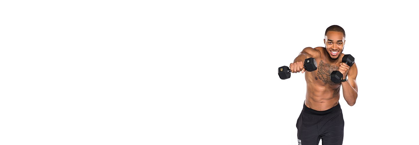 Shirtless Barry's Bootcamp instructor Justyn Solomon doing cross punch with dumbbells on white background