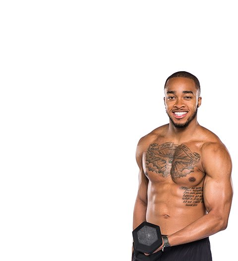 Shirtless Barry's Bootcamp instructor Justyn Solomon holding dumbbell on white background
