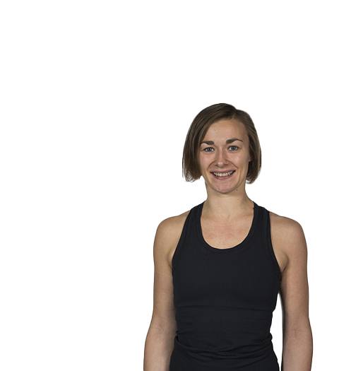 Barry's Bootcamp instructor Katariina Kivekäs in black tank top smiling on white background