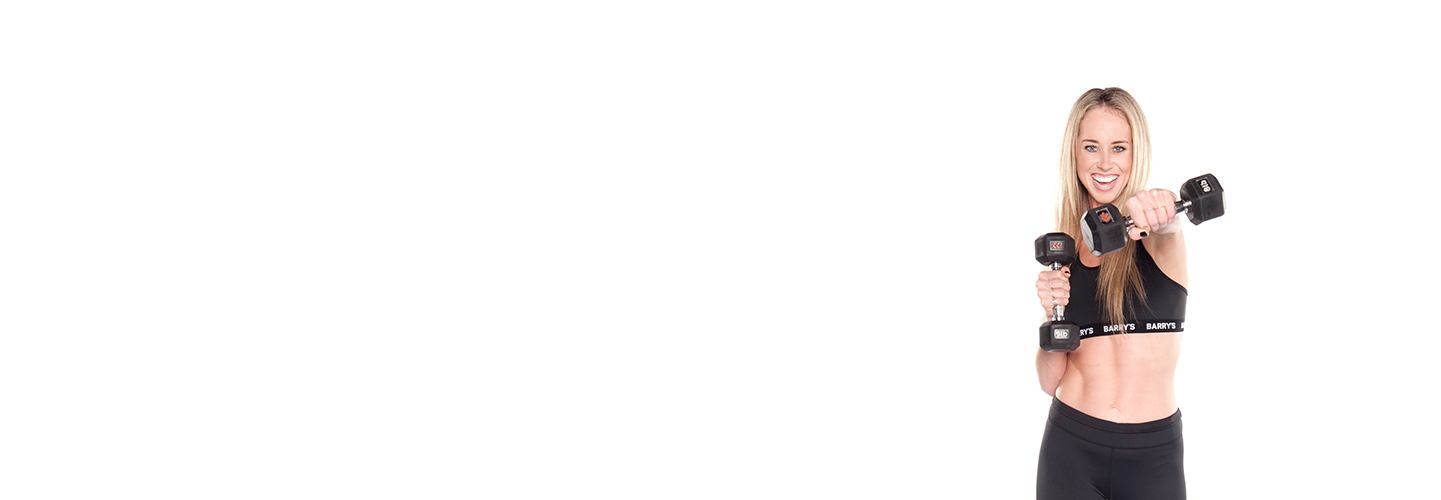 Instructor Mackenzie Hester in black Barry's Bootcamp sports bra doing cross punch with dumbbells on white background