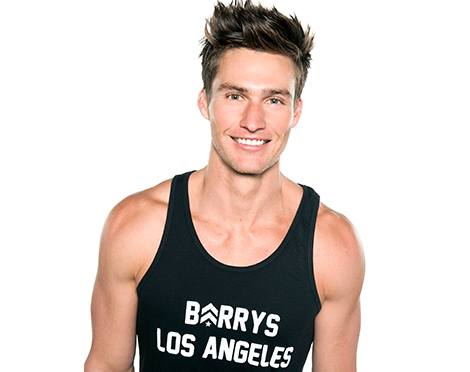 Headshot of instructor Matt W in black Barry's Bootcamp tank top smiling on white background