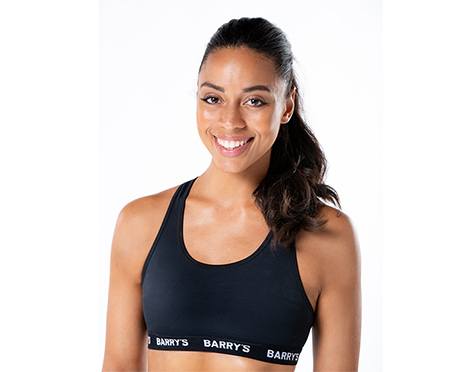 Headshot of Barry's Bootcamp instructor Mercedes Owens against a white background.