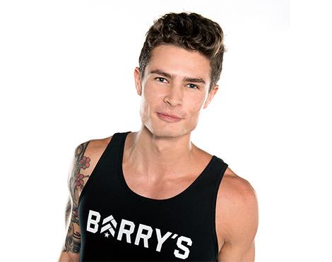 Headshot of instructor Nolan Zarlin in black Barry's Bootcamp tank top on white background