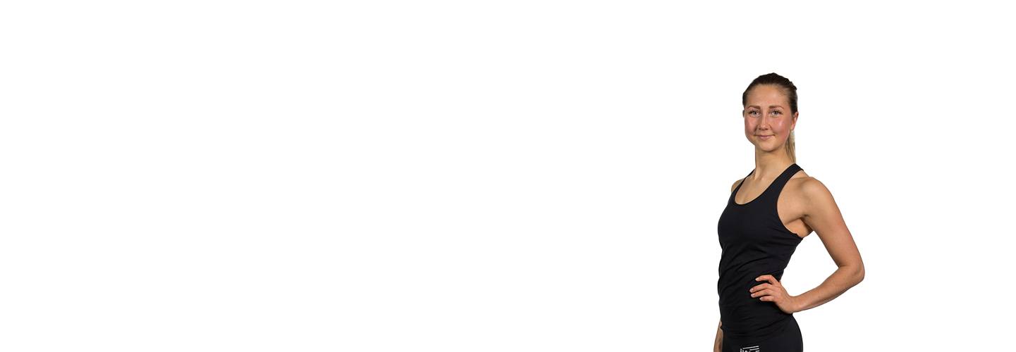 Barry's Instructor Ragna Rikheim wearing black tank with hand on hip