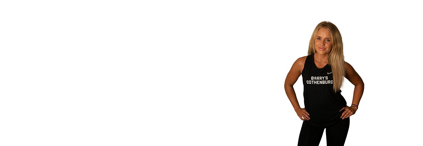 Barry's Bootcamp instructor Therese Svensson against a white background with her hands on her hips.