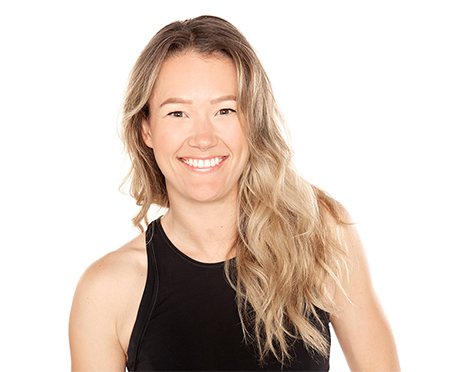 Headshot of Barry's Bootcamp instructor Georgia Fitzgerald wearing a black tank top against a white background.
