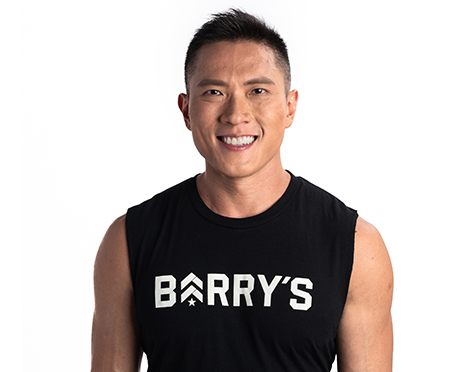 Headshot of instructor Ian Chan in Barry’s Bootcamp tank on white background