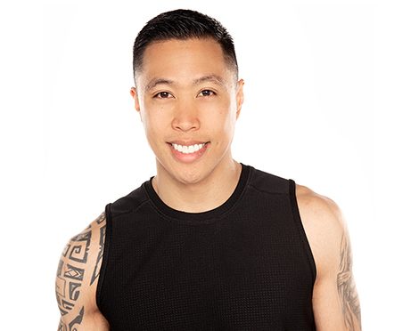 Headshot of Barry's Bootcamp instructor Matt Marquez smiling and wearing a black tank top against a white background.