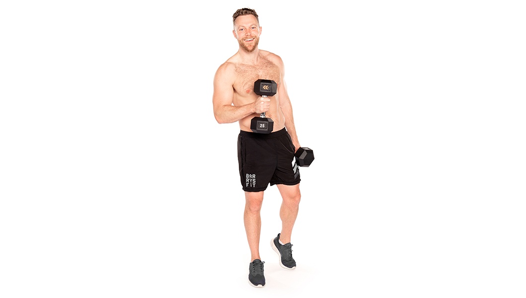 Barry's Bootcamp instructor Tommy Killen shirtless, doing a bicep curl with a dumbbell against a white background.
