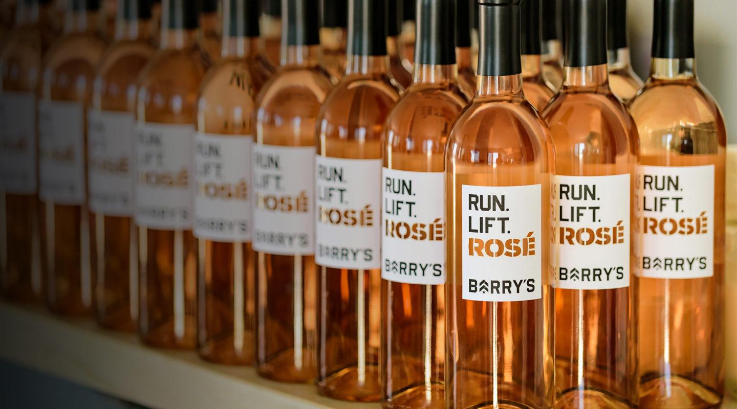 Barry's Bootcamp run lift rosé bottles sitting on shelf