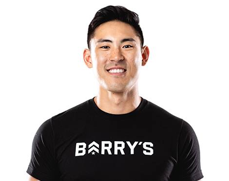 Barry's instructor standing confidently wearing a black top against a white background.