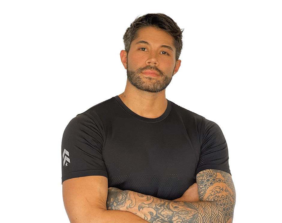 Barry's instructor standing confidently wearing a black top against a white background.