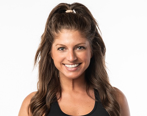 Barry's instructor standing confidently smiling wearing a black top against a white background.