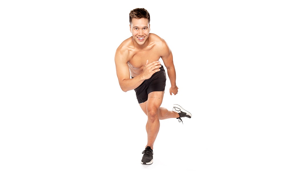 Barry's instructor shirtless with black shorts running against a white background.