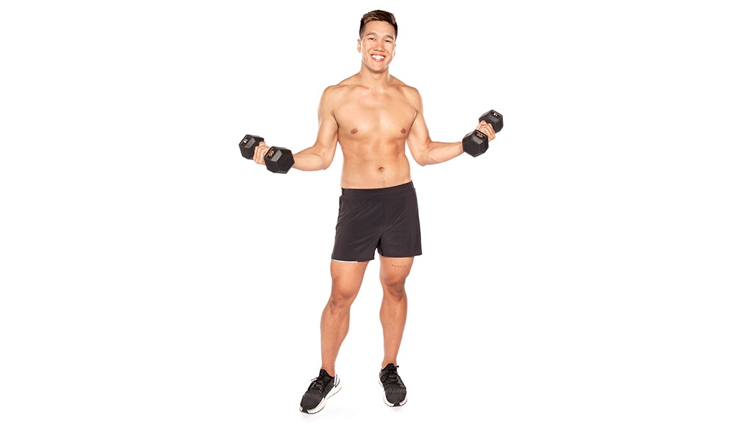 Barry's instructor shirtless with black shorts with weights out to the side.