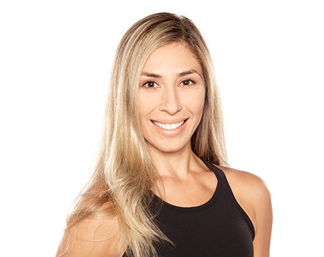 Barry's instructor standing confidently wearing a black top against a white background.