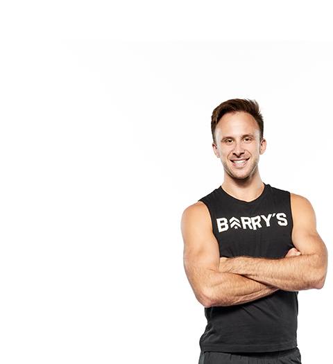 Barry's instructor standing confidently wearing a black top against a white background.