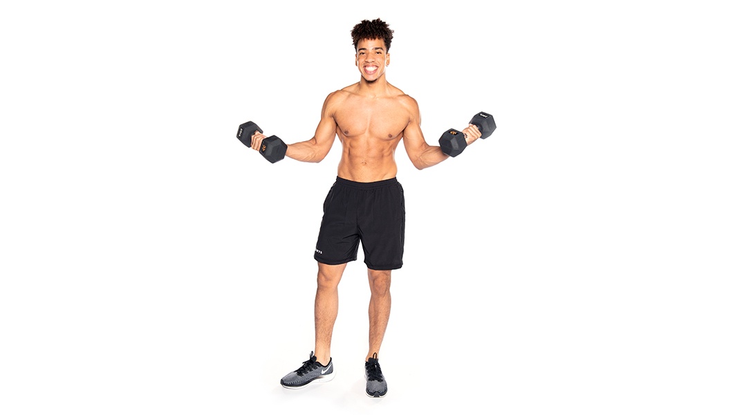 Barry's instructor holding weights out to the side shirtless wearing black shorts against a white background