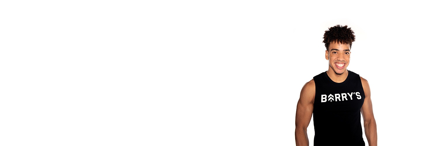 Barry's instructor standing confidently wearing a black top against a white background.