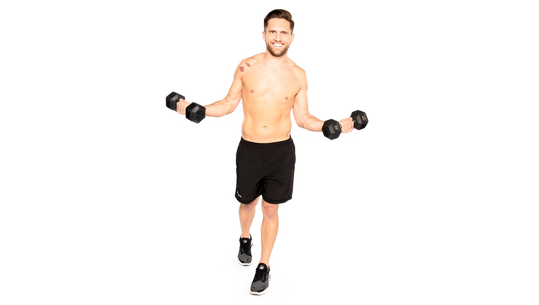 Barry's instructor standing confidently holding weights shirtless against a white background.