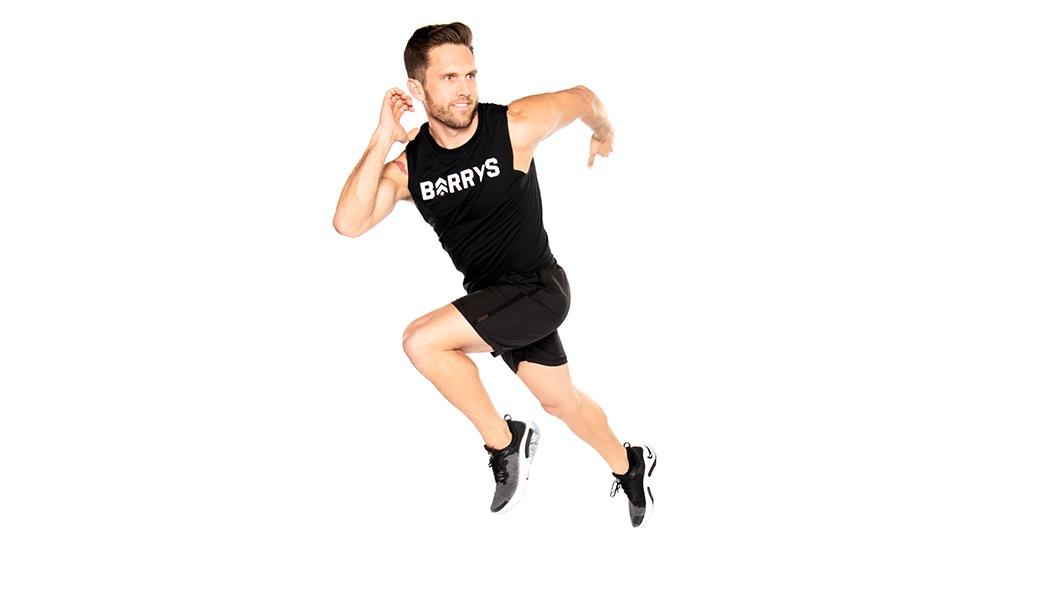 Barry's instructor in running position wearing a black top against a white background.
