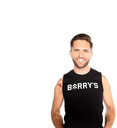Barry's instructor standing confidently wearing a black top against a white background.