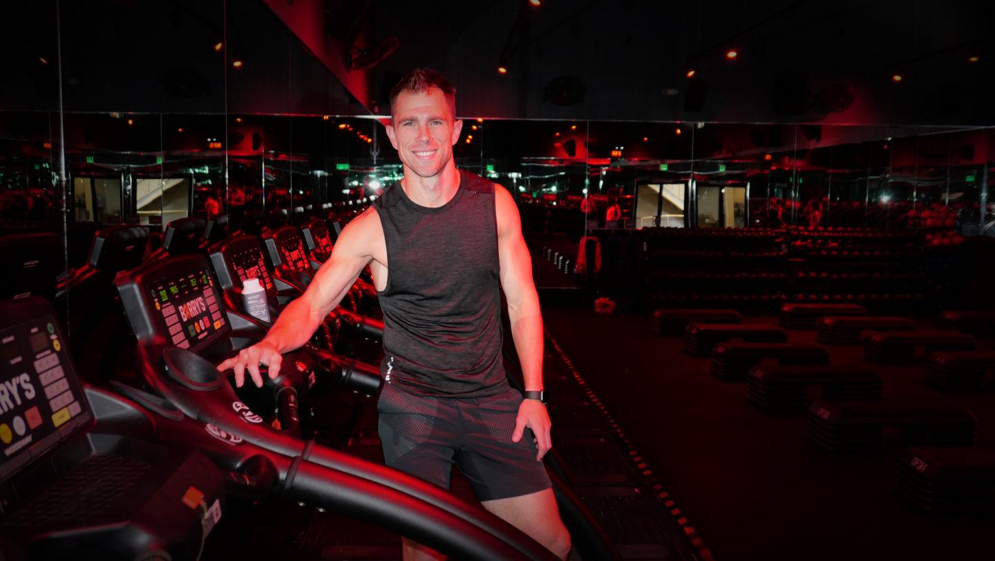 Barry’s Master Trainer, Chris Tye Walker, standing on the treadmill in Barry's Red Room