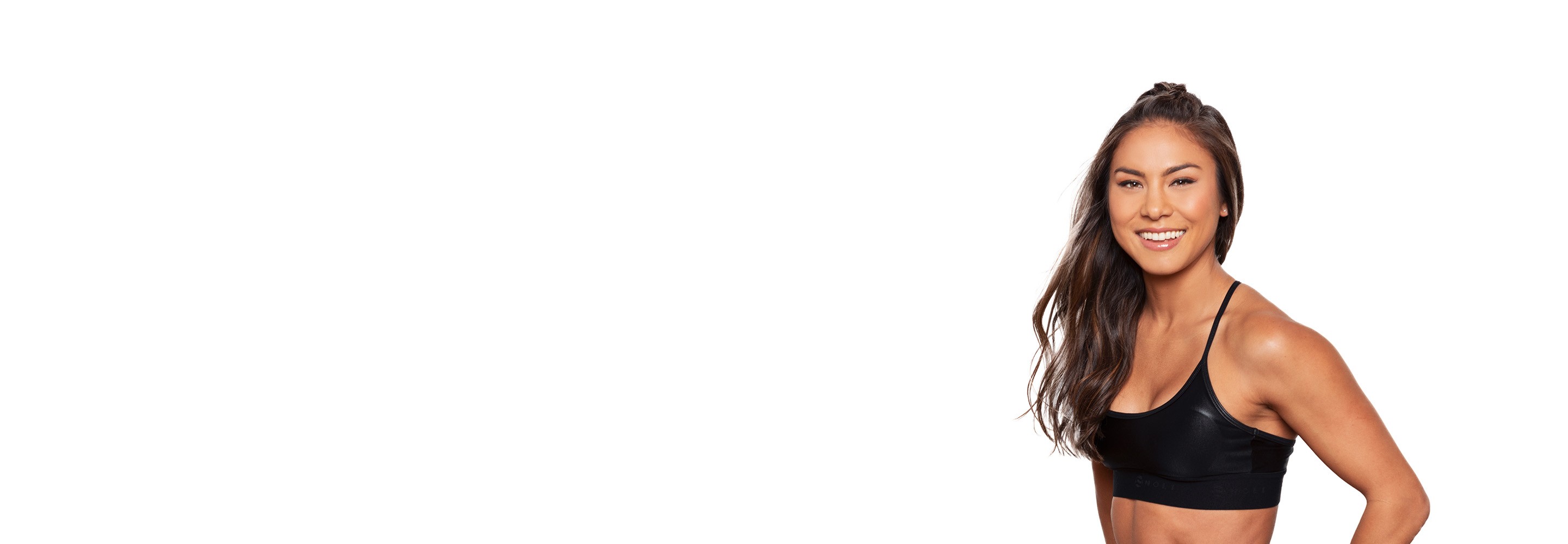 Barry's instructor standing confidently wearing a black top against a white background.