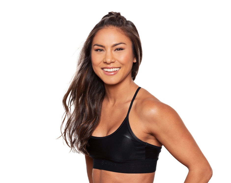 Barry's instructor standing confidently wearing a black top against a white background.