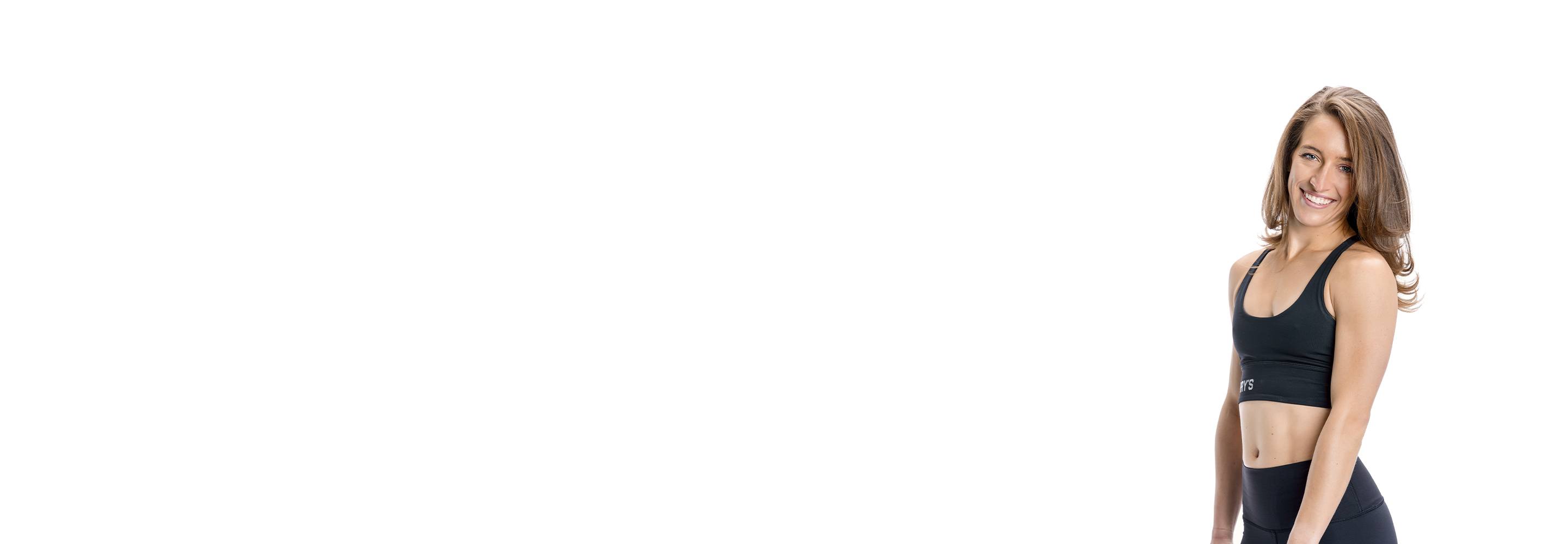 Barrys instruktör står självsäkert klädd i en svart topp mot en vit bakgrund.