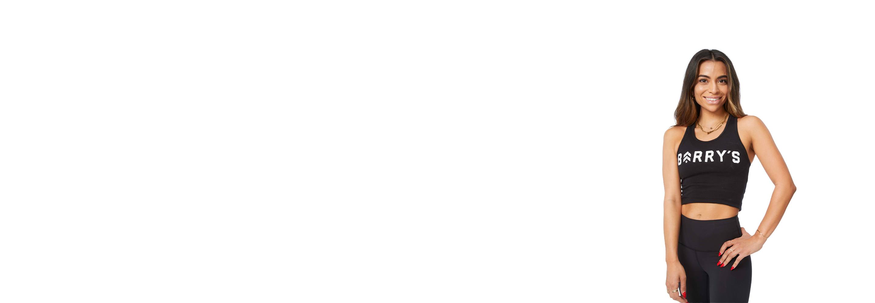 Barry's instructor standing confidently wearing a black top against a white background.