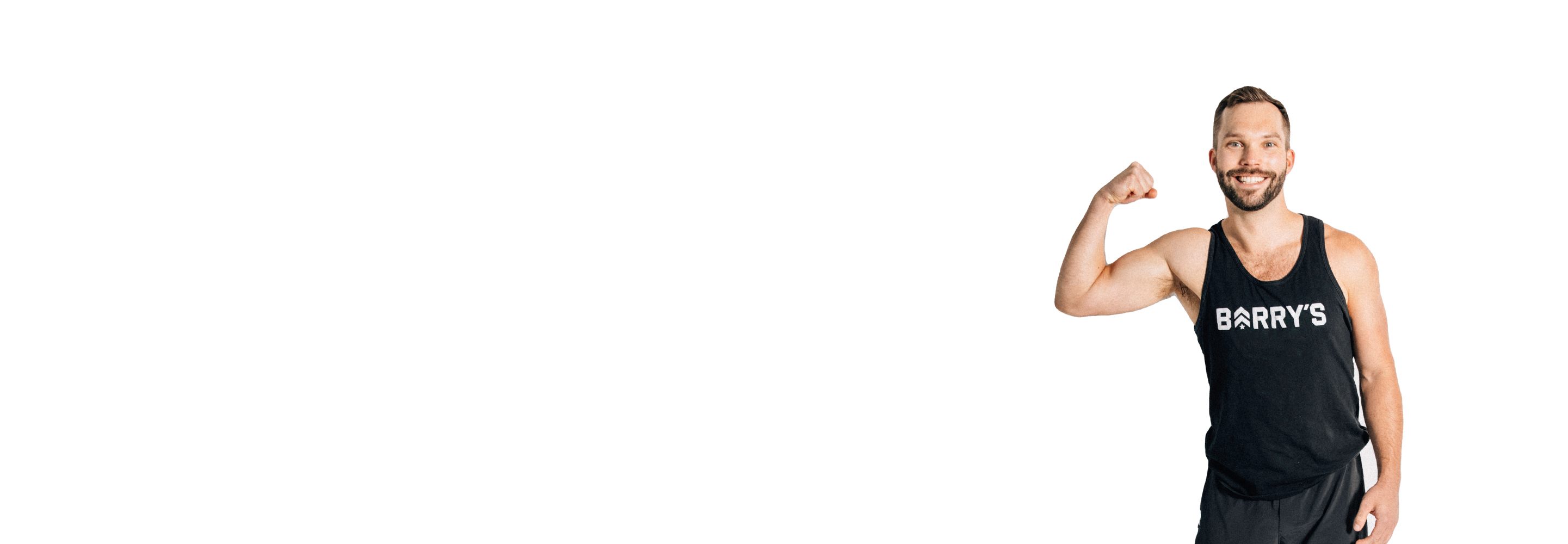 Barry's instructor standing confidently wearing a black top against a white background.