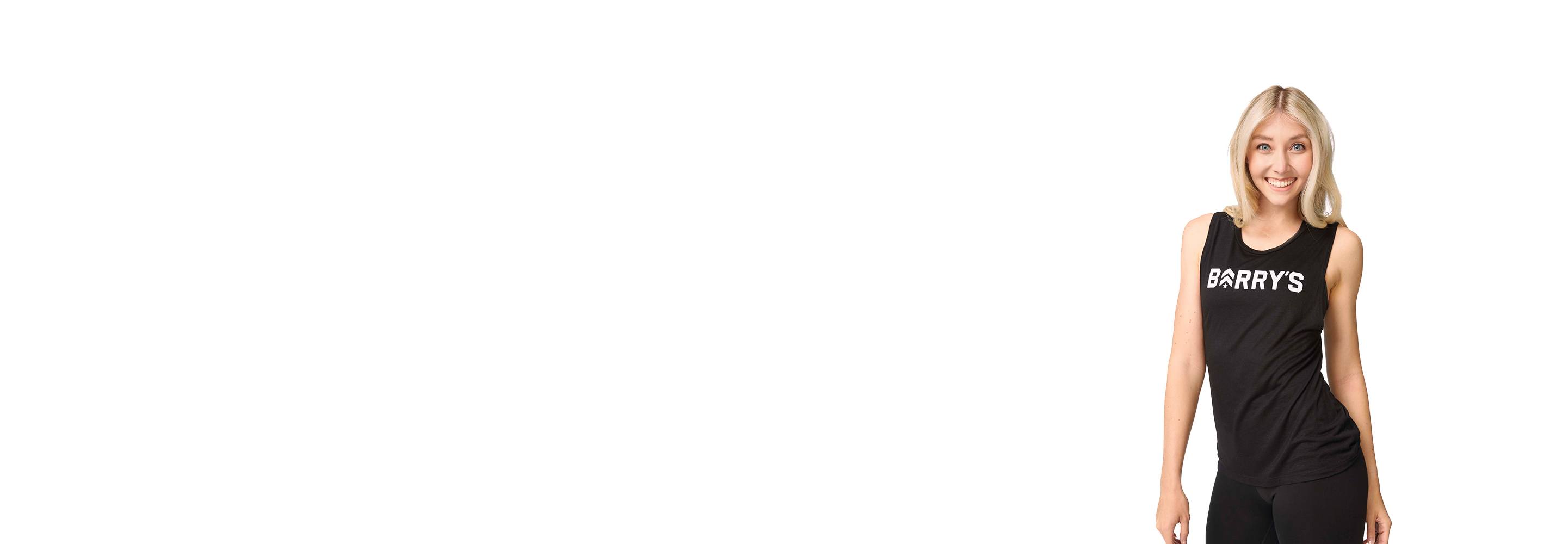 Barry's instructor standing confidently wearing a black top against a white background.