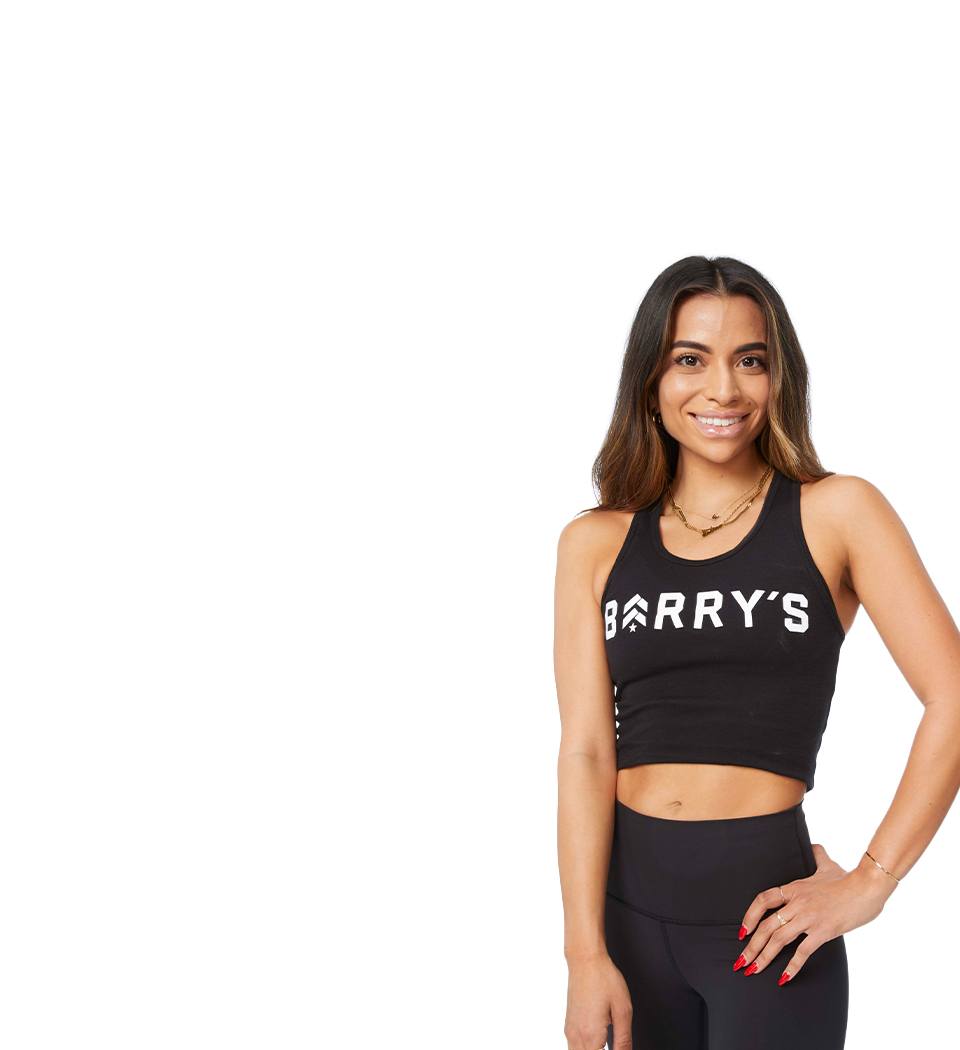 Barry's instructor standing confidently wearing a black top against a white background.