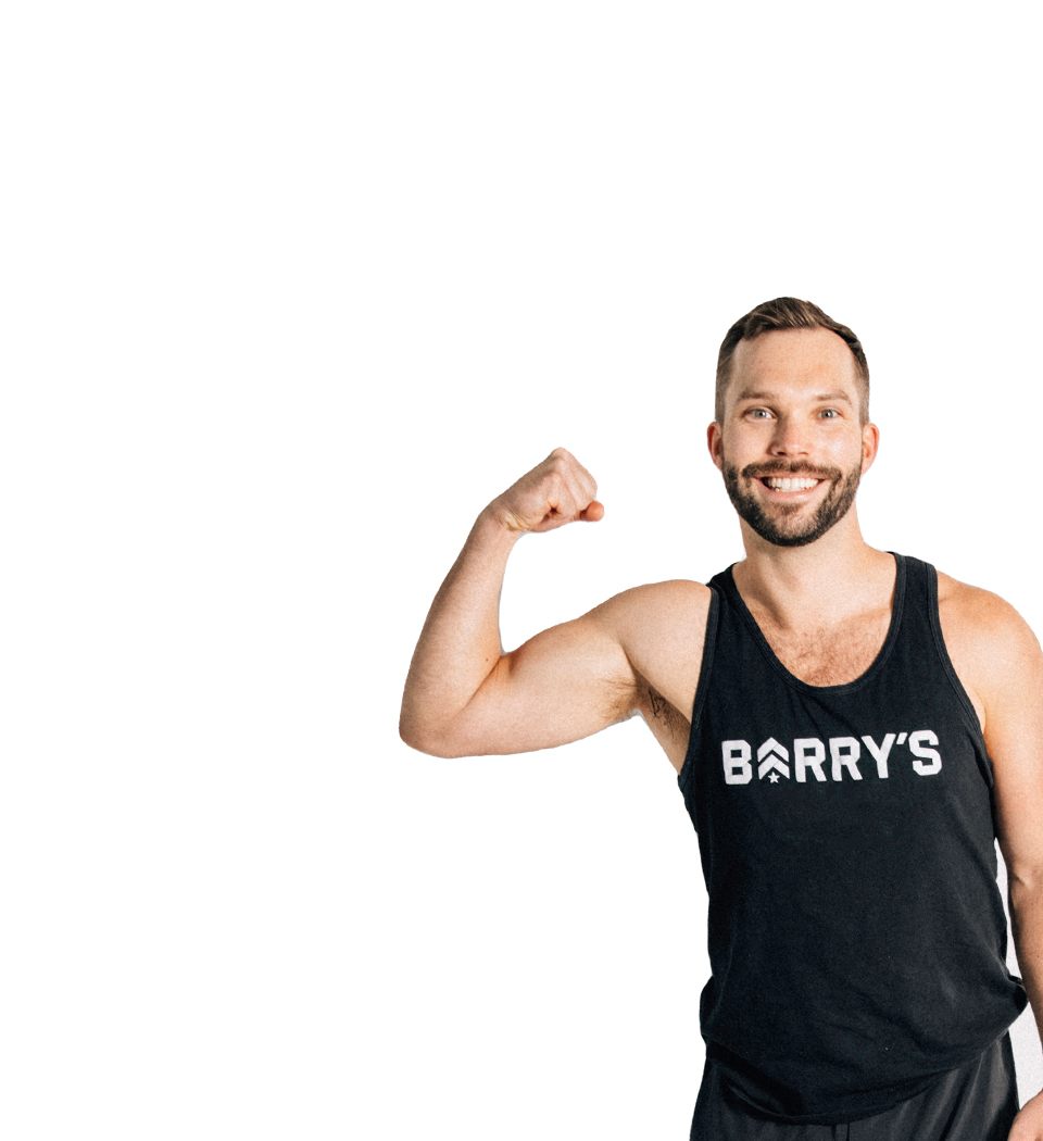 Barry's instructor standing confidently wearing a black top against a white background.