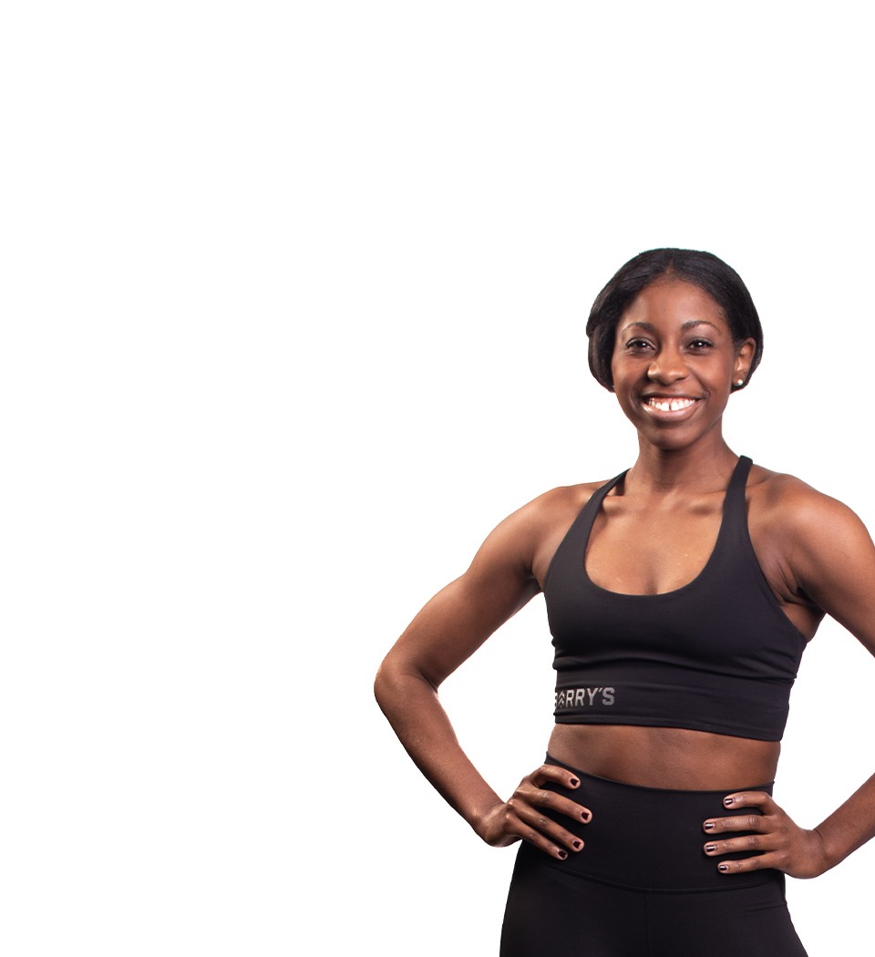 Barry's instructor standing confidently wearing a black top against a white background.