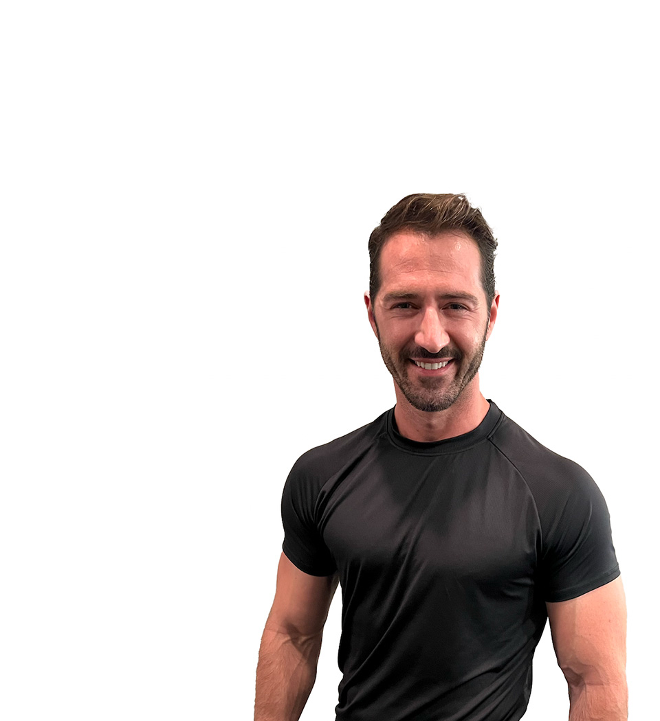 Barry's instructor standing confidently wearing a black top against a white background.
