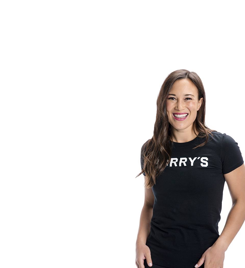 Barry's instructor standing confidently wearing a black top against a white background.