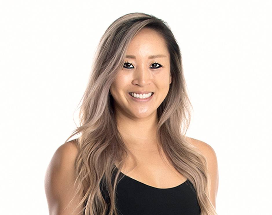 Barry's instructor standing confidently wearing a black top against a white background.