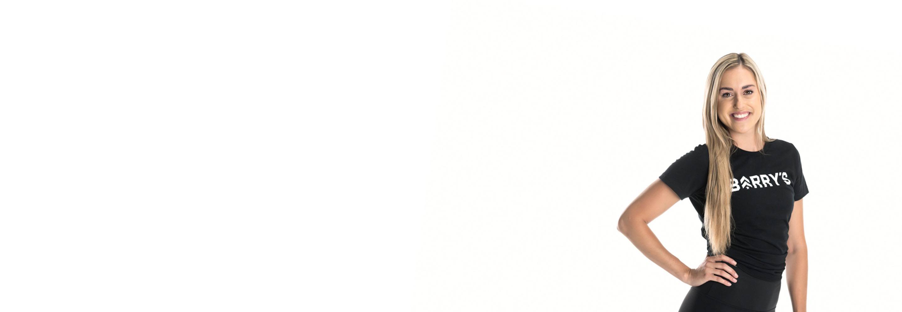 Barry's instructor standing confidently wearing a black top against a white background.