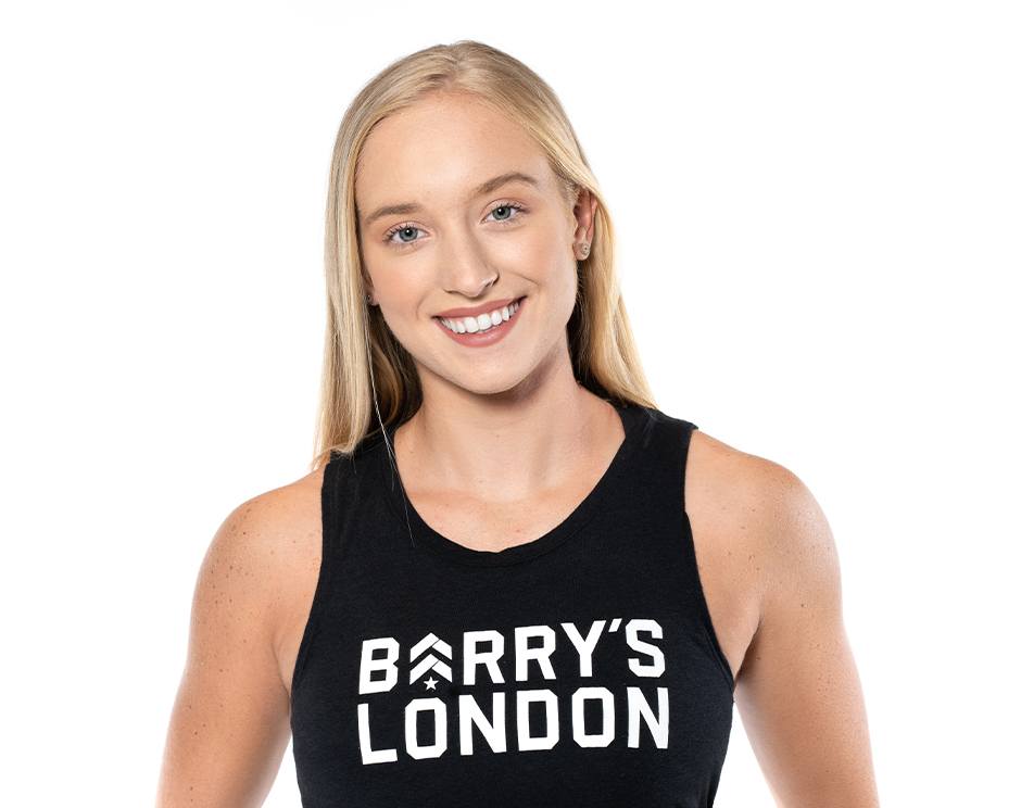Barry's instructor standing confidently wearing a black top against a white background.